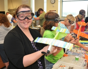 Ashley Stefanisin, science teacher at Bartelso Elementary, demonstrates her work as participants study engineering design and composite materials.
