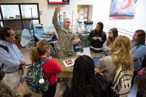 U.S. Army Combat Medic Thomas Fortner presents to SIUE School of Nursing students.