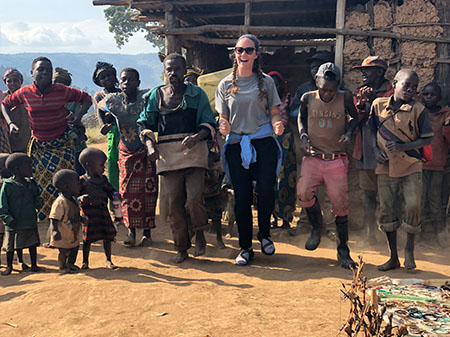 SIUE’s Cheyenne Durham, of Swansea, joins dancers at the Batwa village students visited on Lake Bunyonyi during their travels study program in Uganda.