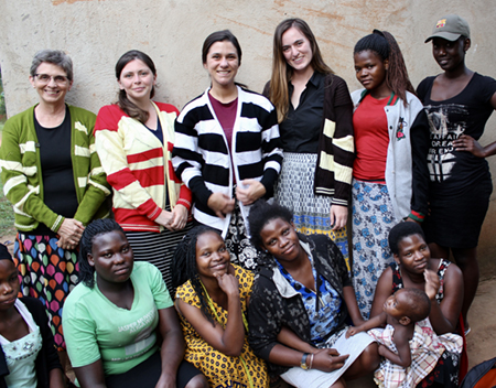 (back L-R) SIUE Dr. Kathryn Brady and speech language pathology students Katherine Wilson, Brianna Bowles and Sarah Geatley stand with women who work in a knitting workshop in Mukono, Uganda.