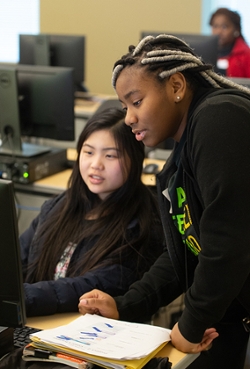 (L-R) Juniors Abby Liu, of Edwardsville, and Nyla Cohen, of Cahokia, work together during SheCode.