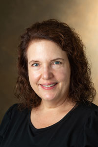 A portrait photo of Alison Reeves, Co-Chair