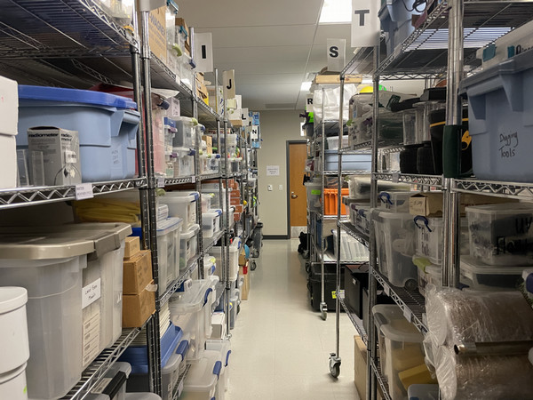 Stacks of inventory in back room of STEM Library