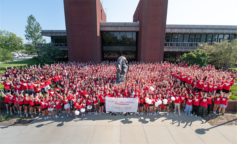 High angle photo of more than a thousand students surrounding the Cougar statue on the Stratton Quad