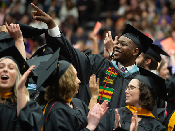 Smiling students at SIUE commencement