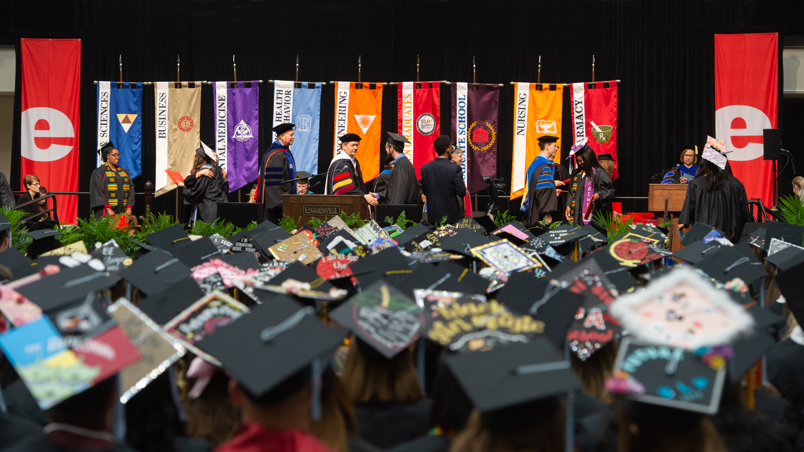 Graduates crossing stage