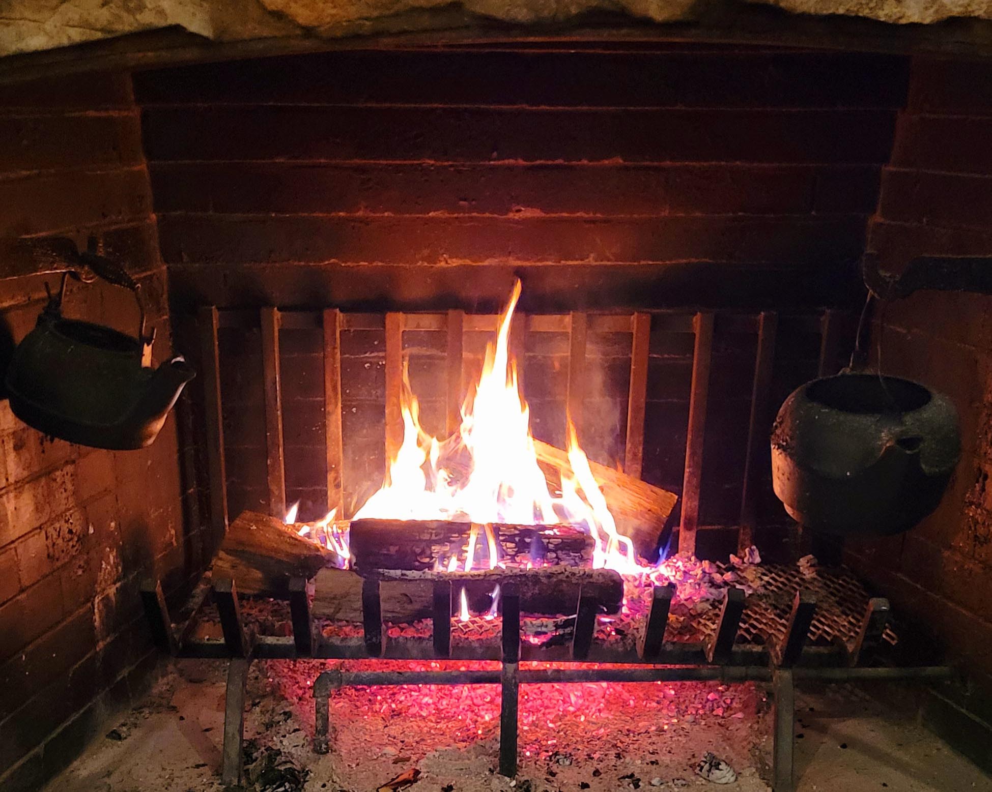 fire with red ambiance burning in a fireplace